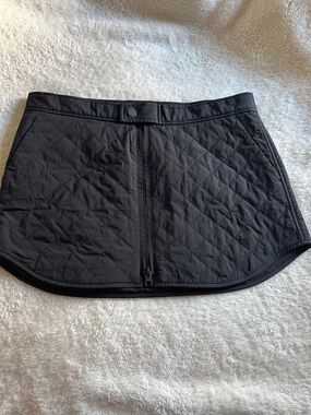Athleta Toasty Buns Quilted Insulated Skirt in black.